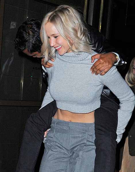 Jennifer Lawrence carries Aziz Ansari to his car after SNL After Party
